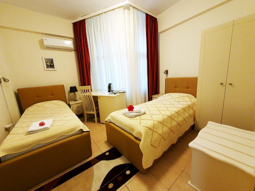 Postel nebo postele na pokoji v ubytování Hotel Florentina