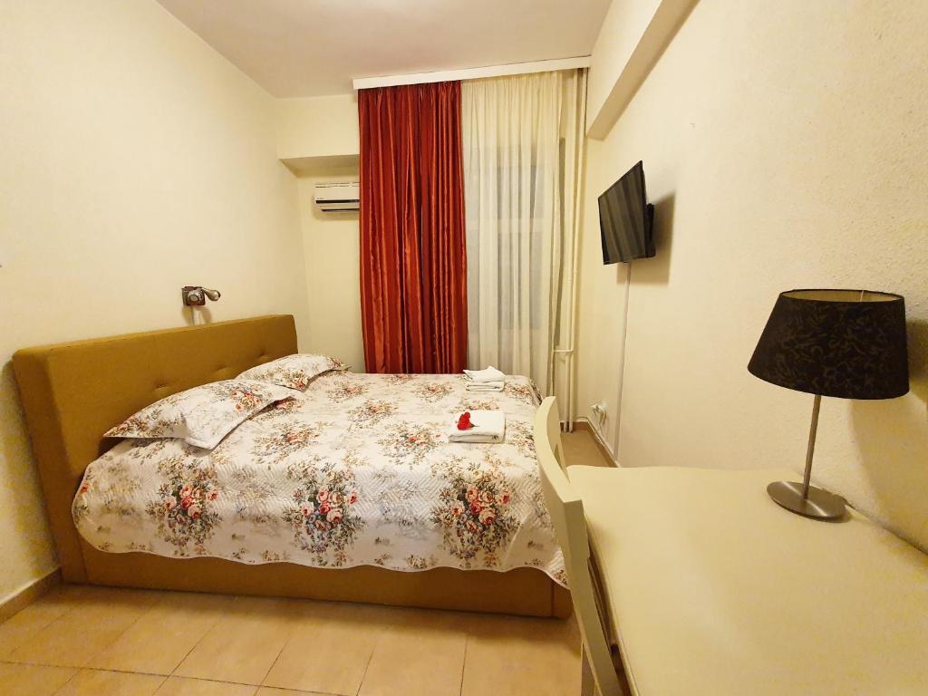 Postel nebo postele na pokoji v ubytování Hotel Florentina