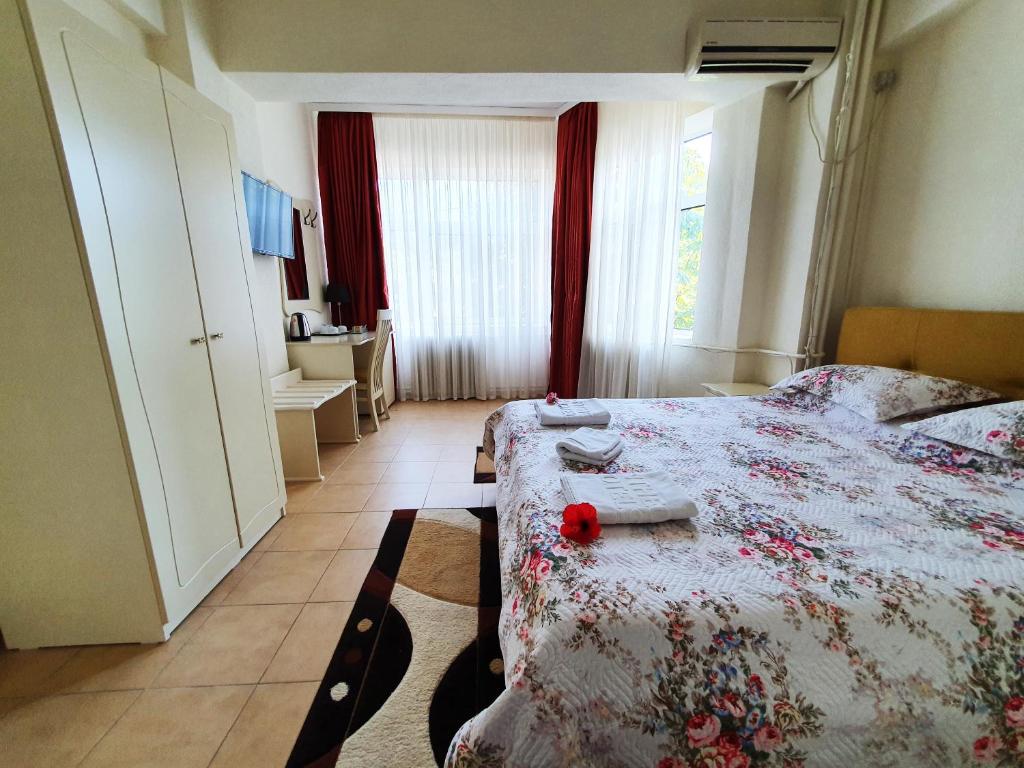 Postel nebo postele na pokoji v ubytování Hotel Florentina
