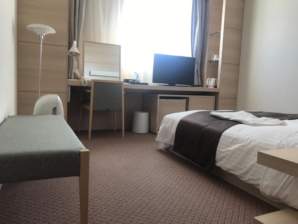 Postel nebo postele na pokoji v ubytování Sunrise Choshi