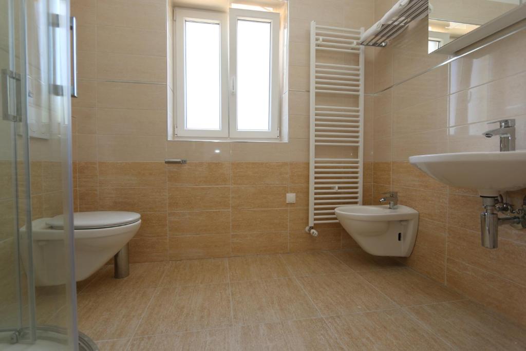 Ванная комната в Apartments Sucic Iva i Tea