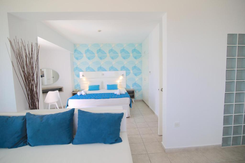 Postel nebo postele na pokoji v ubytování Lantiana Gardens ApartHotel
