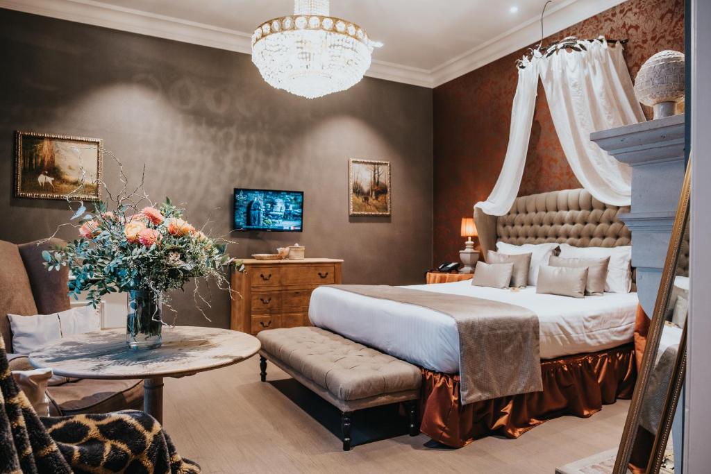 Postel nebo postele na pokoji v ubytování Boutique Hotel De Castillion