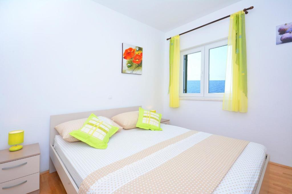 Posteľ alebo postele v izbe v ubytovaní Apartments Punta Milna
