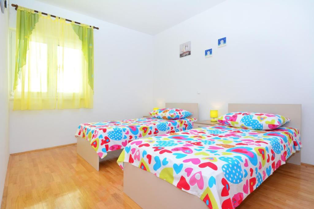 Posteľ alebo postele v izbe v ubytovaní Apartments Punta Milna