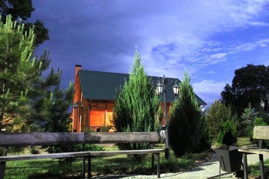 a house with a fence in front of it at Сруб Вилково in Vylkove