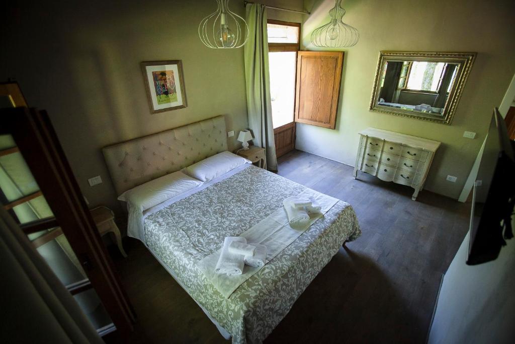 Łóżko lub łóżka w pokoju w obiekcie Mulino in Chianti