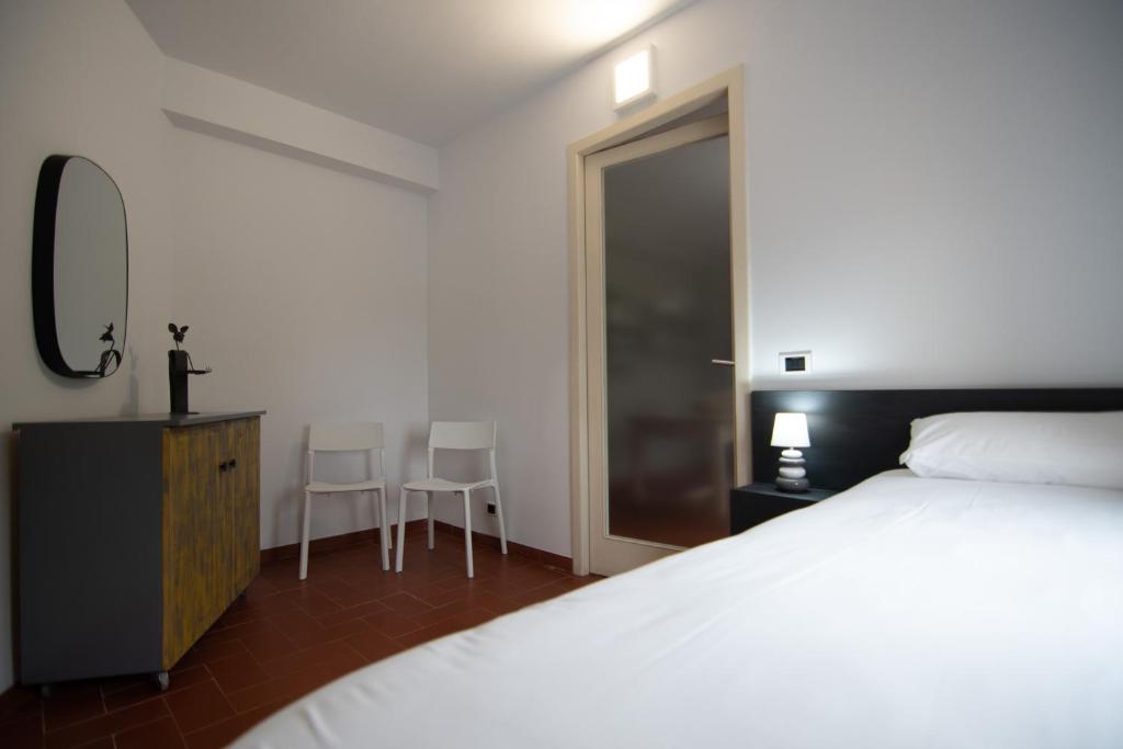 Posteľ alebo postele v izbe v ubytovaní VILLA DEL RIU