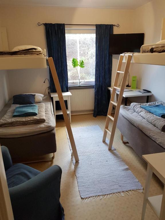 Postel nebo postele na pokoji v ubytování Laholms Vandrarhem