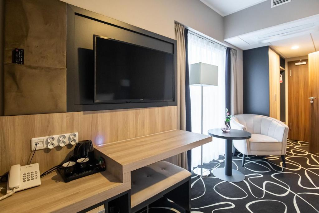 TV a/nebo společenská místnost v ubytování Trofana Wellness & SPA