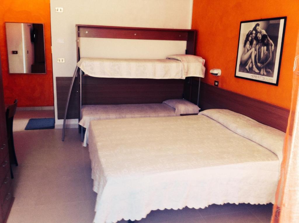 Postel nebo postele na pokoji v ubytování Hotel Amoha