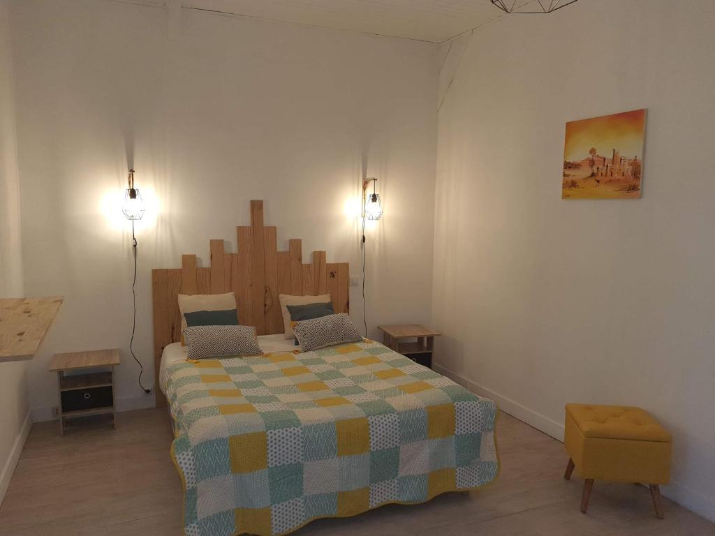 Una cama o camas en una habitaci&oacute;n de L&#39;oasis