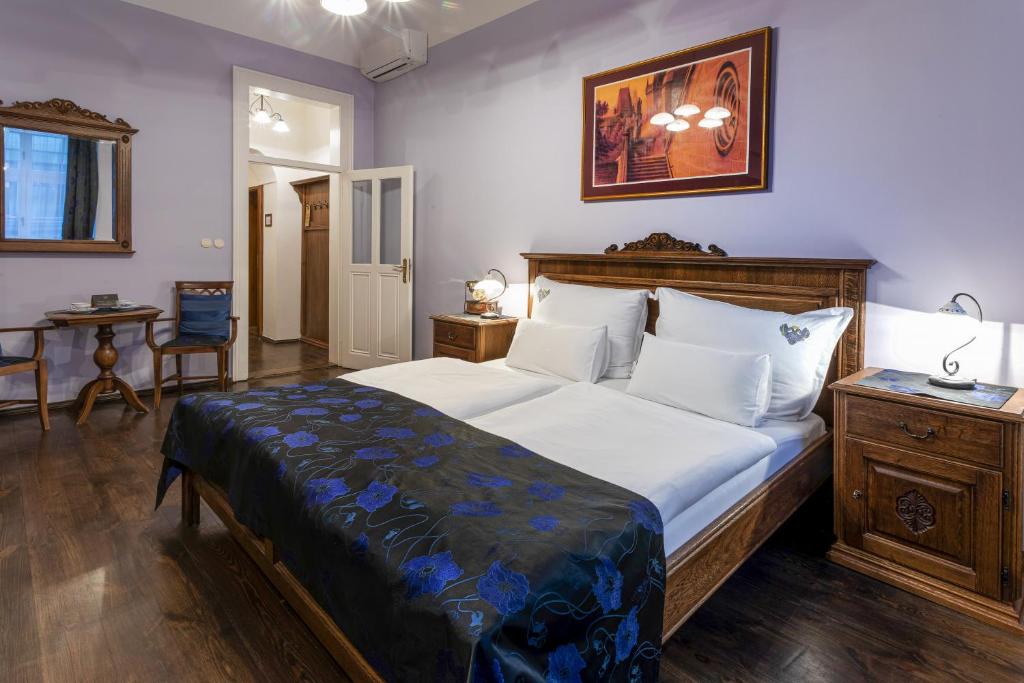 Postel nebo postele na pokoji v ubytování Residence U Černého Orla