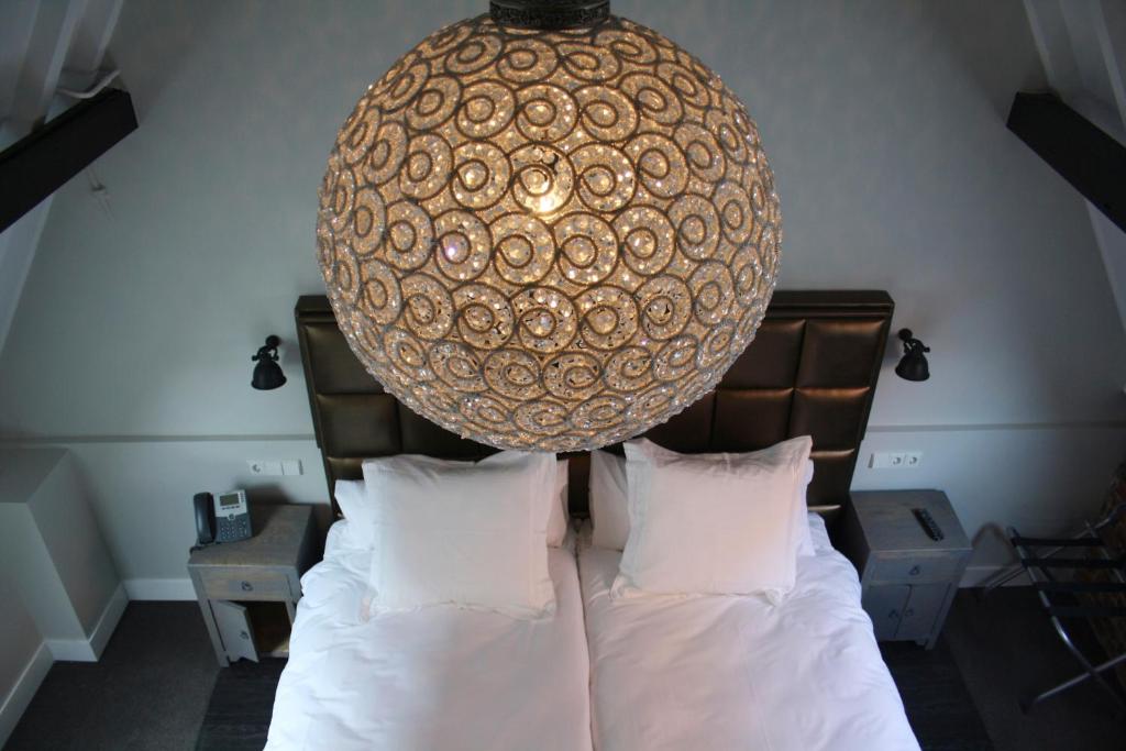 Postel nebo postele na pokoji v ubytování Hotel 't Keershuys