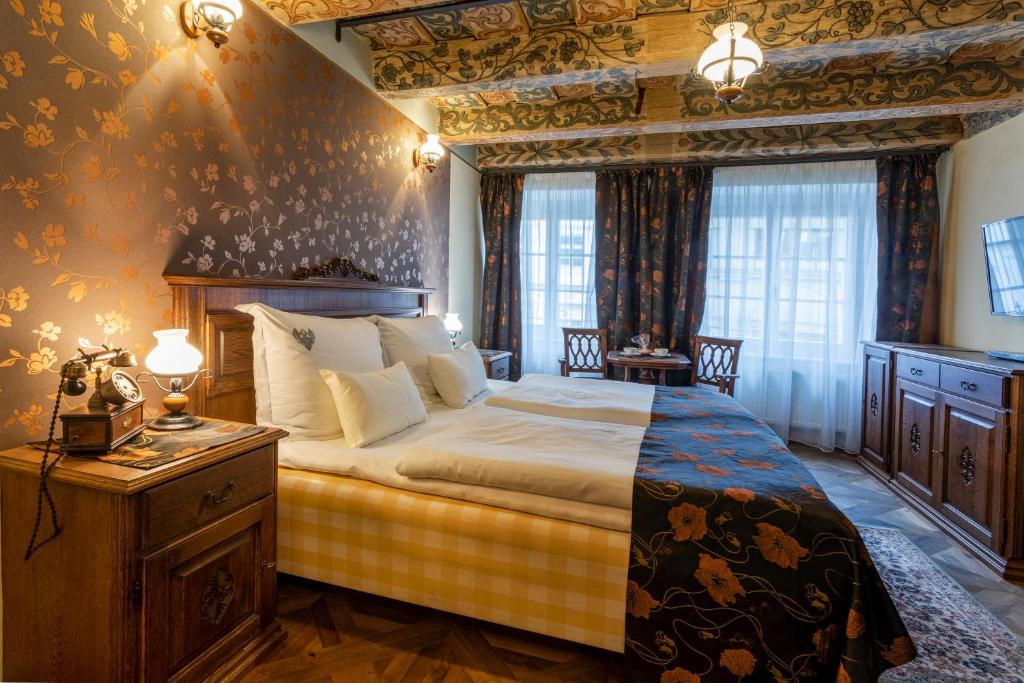 Postel nebo postele na pokoji v ubytování Residence U Černého Orla