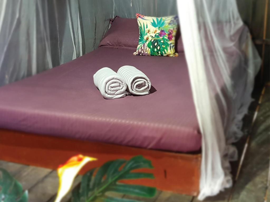Postel nebo postele na pokoji v ubytování Harrera Perhentian, Long Beach