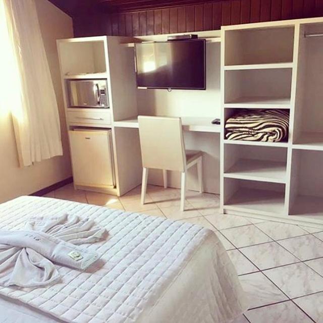 Cama ou camas em um quarto em Pousada Vila Del Mare - Frente Praia