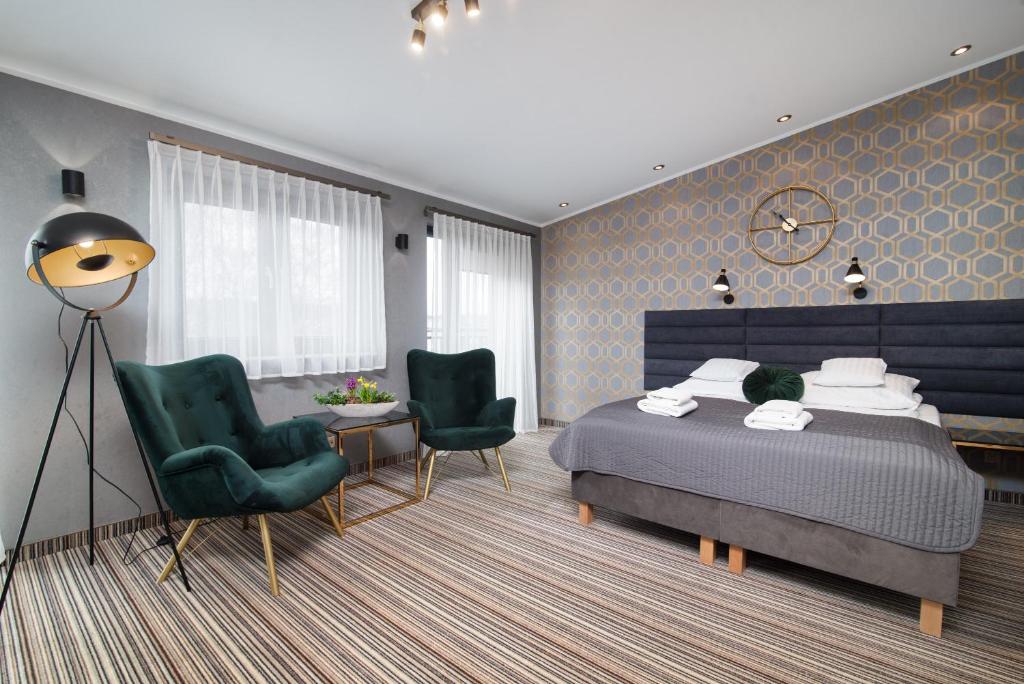 Postel nebo postele na pokoji v ubytování Hotel Rejs