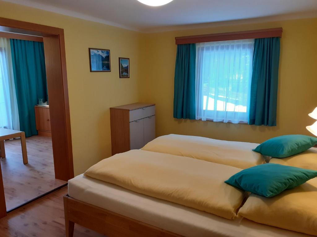 Postel nebo postele na pokoji v ubytování Pension Hirlatz