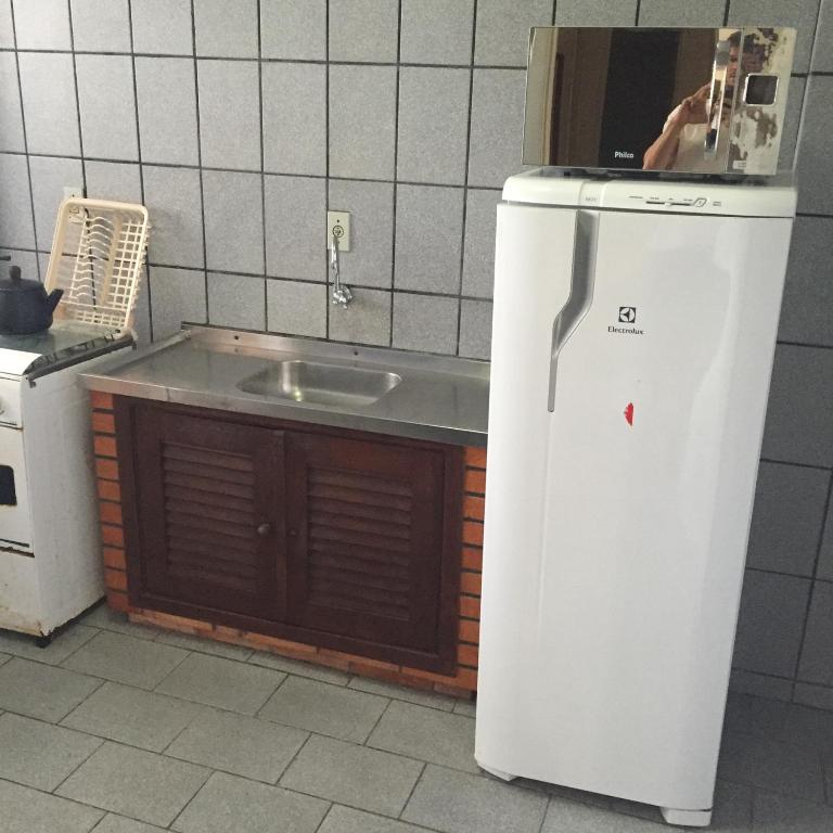 A cozinha ou cozinha compacta de Pousada Vila Del Mare - Frente Praia