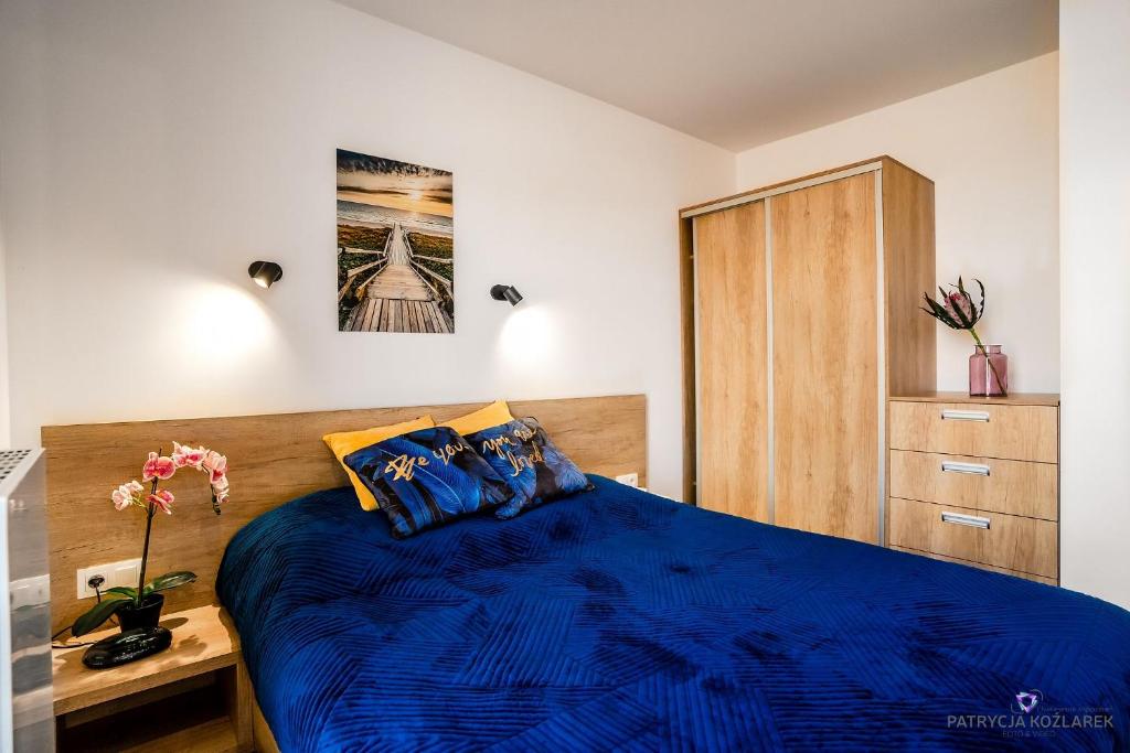 Posteľ alebo postele v izbe v ubytovaní Apartamenty IGMA