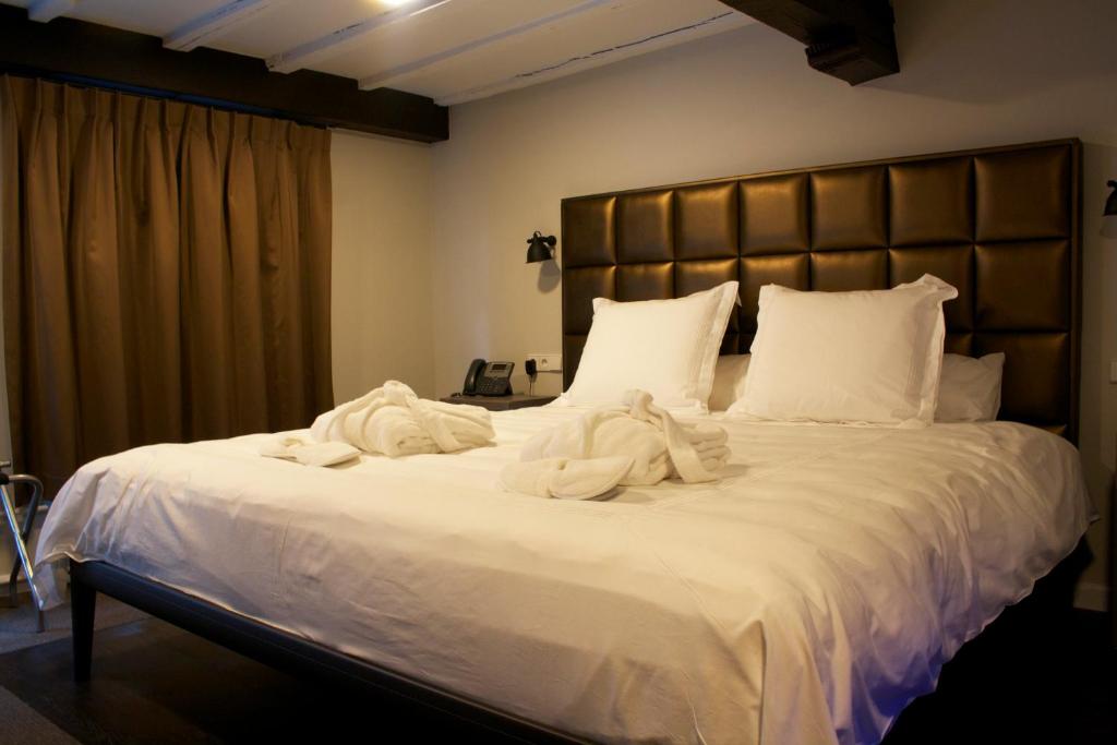 Postel nebo postele na pokoji v ubytování Hotel 't Keershuys