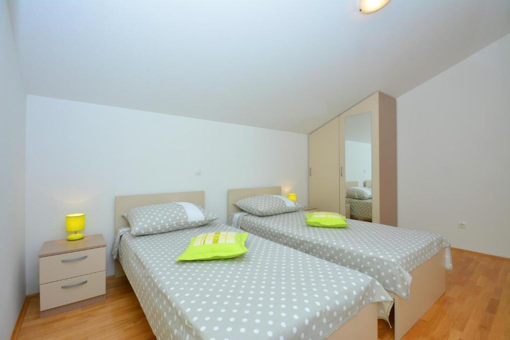 Posteľ alebo postele v izbe v ubytovaní Apartments Punta Milna
