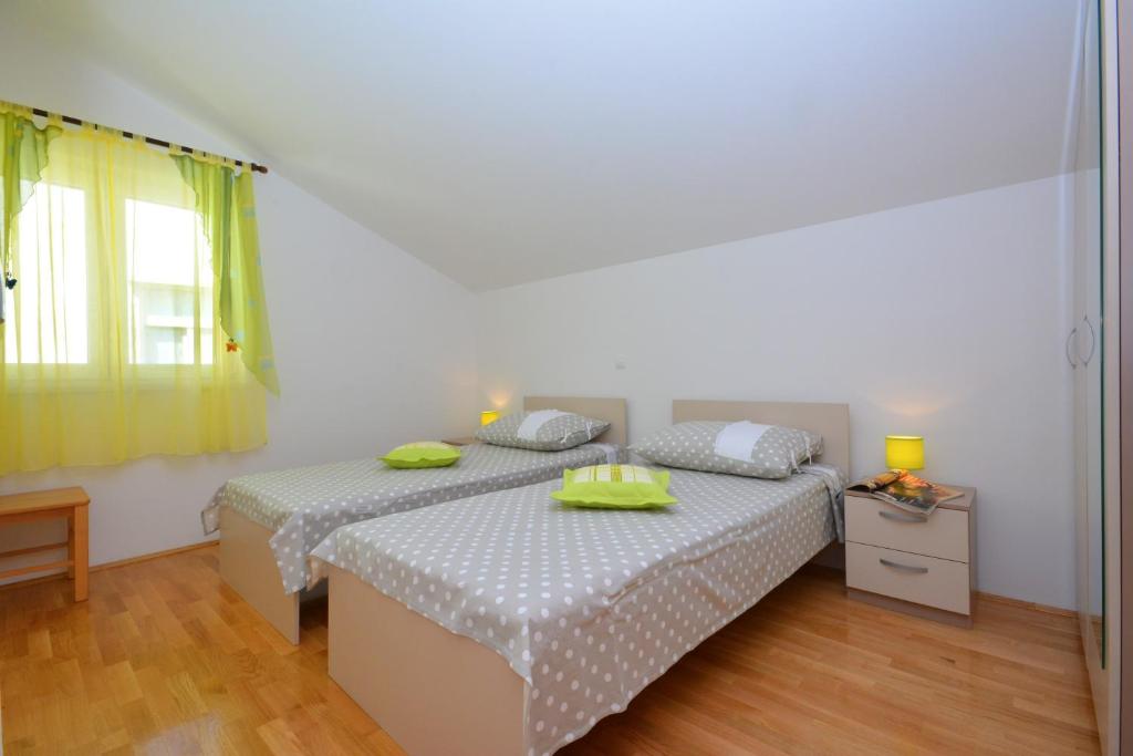 Posteľ alebo postele v izbe v ubytovaní Apartments Punta Milna
