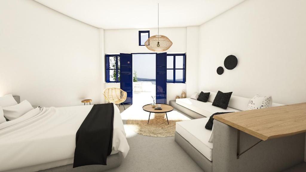 Postel nebo postele na pokoji v ubytování Oia Memories Suites