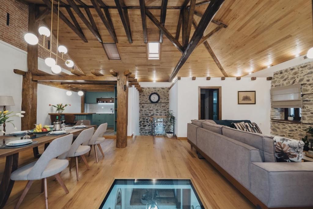 a living room with a couch and a table at Elia City House in Kavala