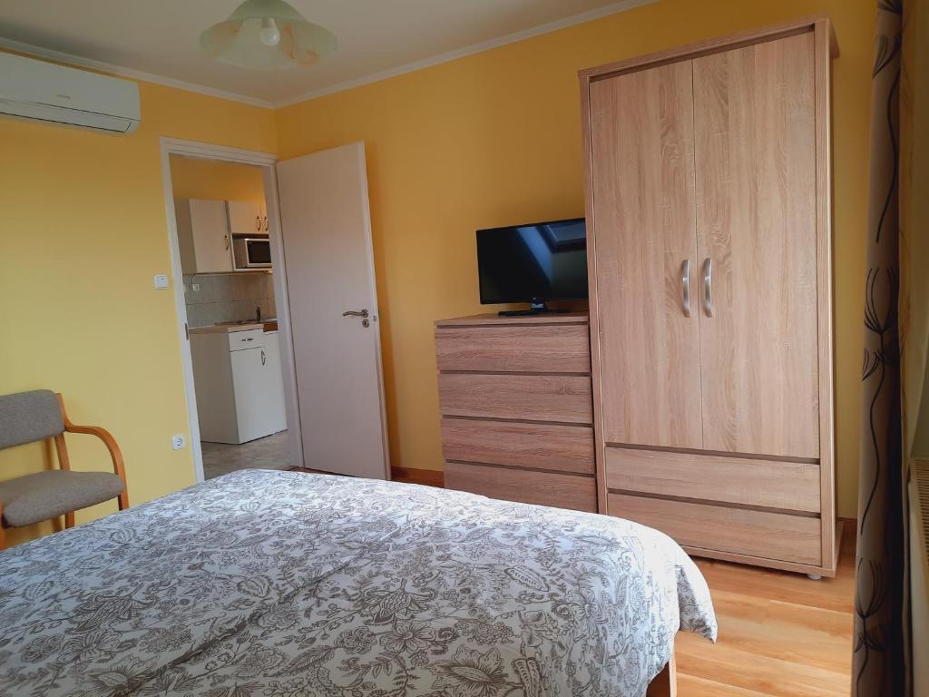 Postel nebo postele na pokoji v ubytování Apartmanház King