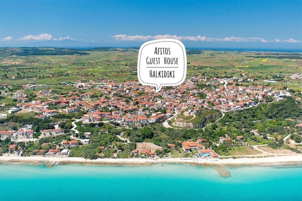 an aerial view of a town on a beach at Afitos Guest House in Afitos