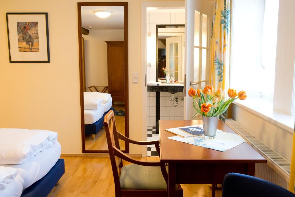 Postel nebo postele na pokoji v ubytování Hotel Weber