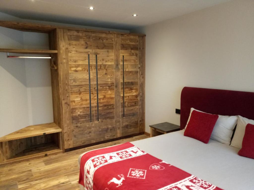 A bed or beds in a room at Baita Ricky