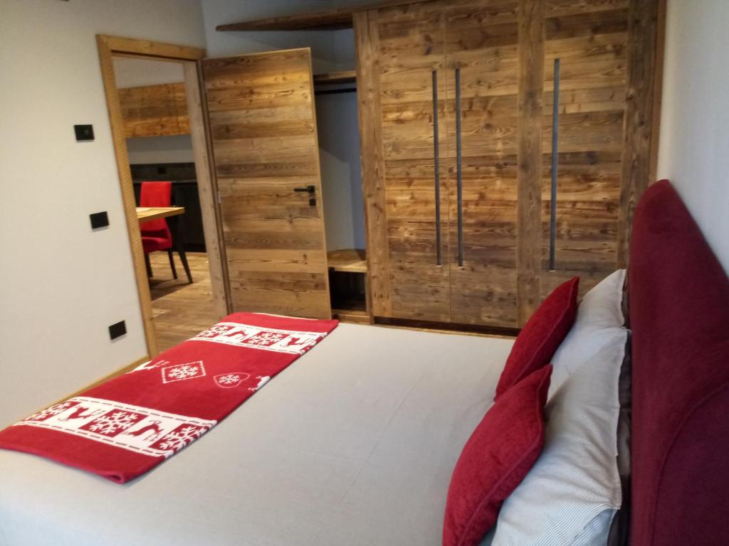 A bed or beds in a room at Baita Ricky