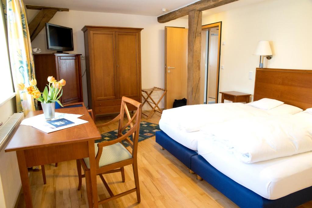Postel nebo postele na pokoji v ubytování Hotel Weber