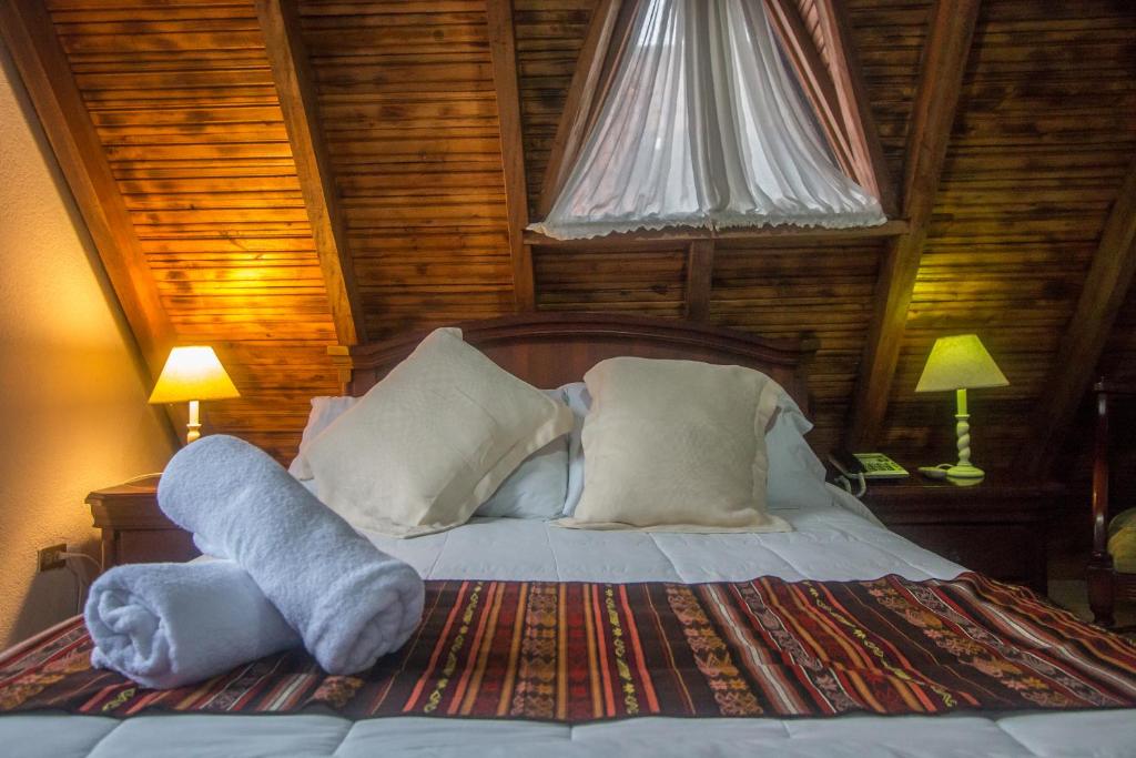 Postel nebo postele na pokoji v ubytování Hosteria Casa Giralda