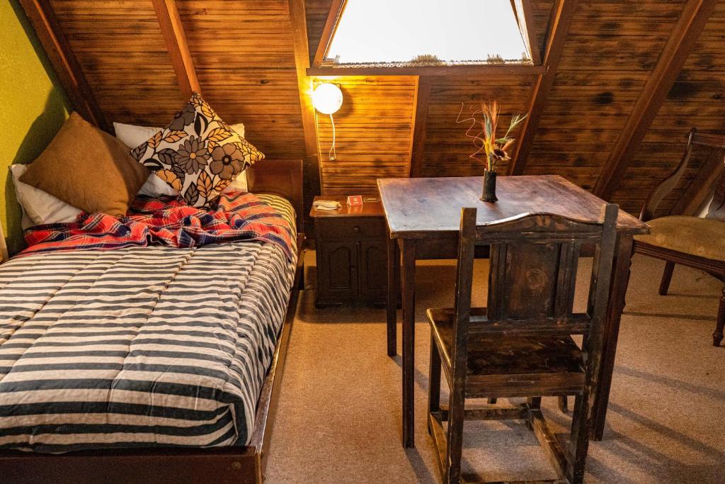 Postel nebo postele na pokoji v ubytování Hosteria Casa Giralda