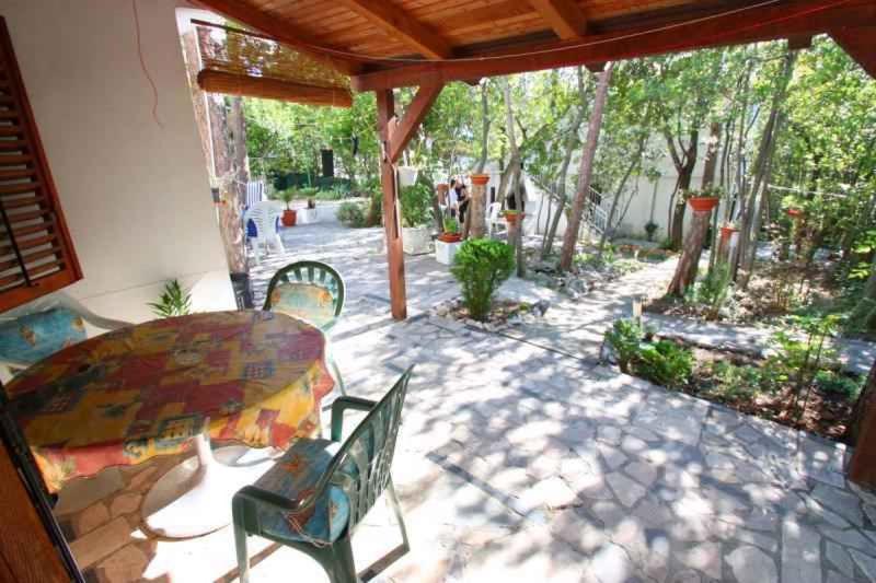 a patio with a table and chairs on a patio at Crikvenica Apartment 89 in Dramalj