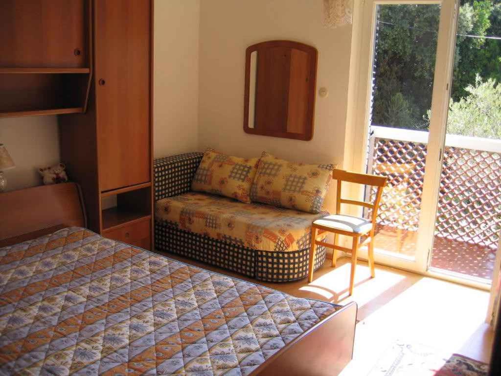 Postel nebo postele na pokoji v ubytování Apartment Supetarska Draga 26