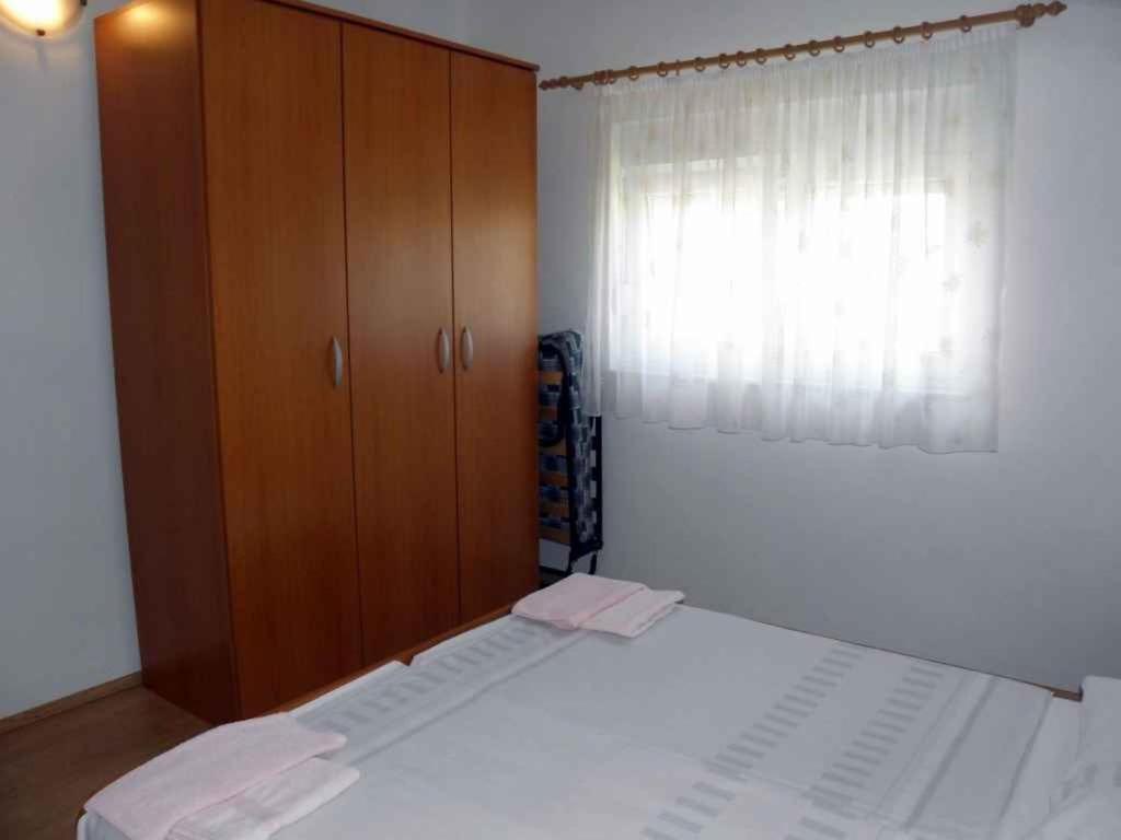 Postel nebo postele na pokoji v ubytování Apartment Barbat 19
