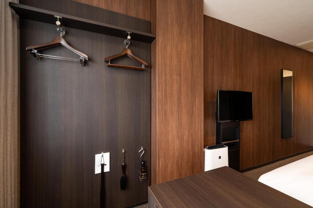TV a/nebo společenská místnost v ubytování Goi Grand Hotel