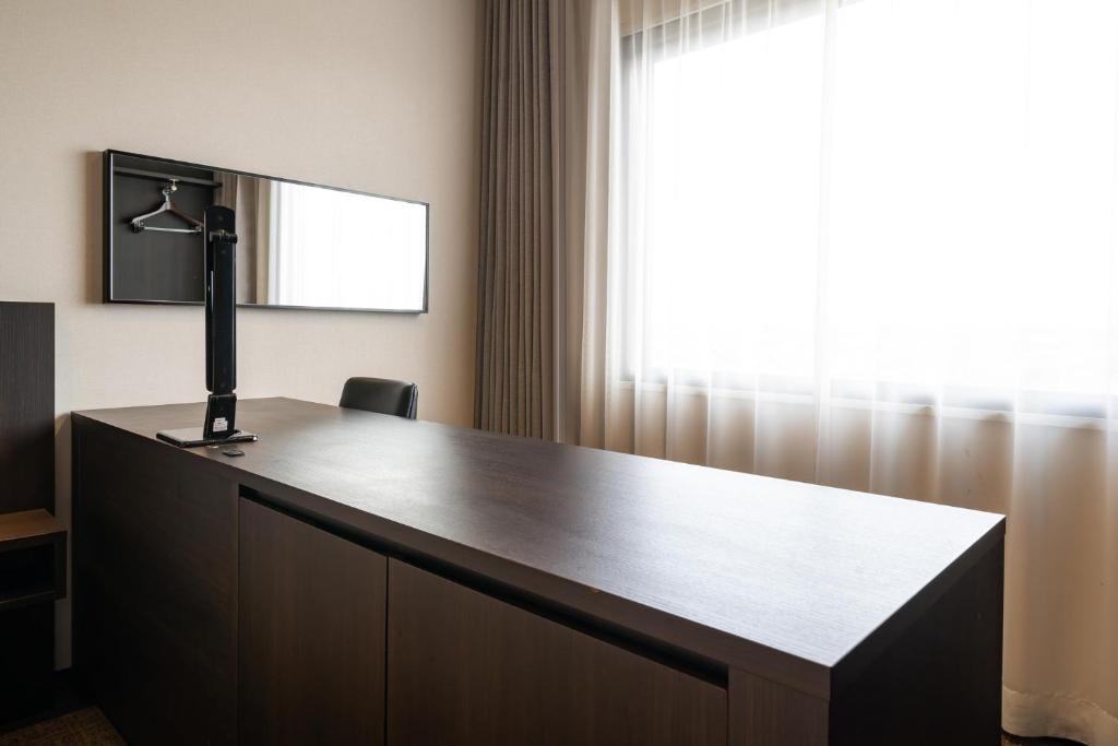 TV a/nebo společenská místnost v ubytování Goi Grand Hotel