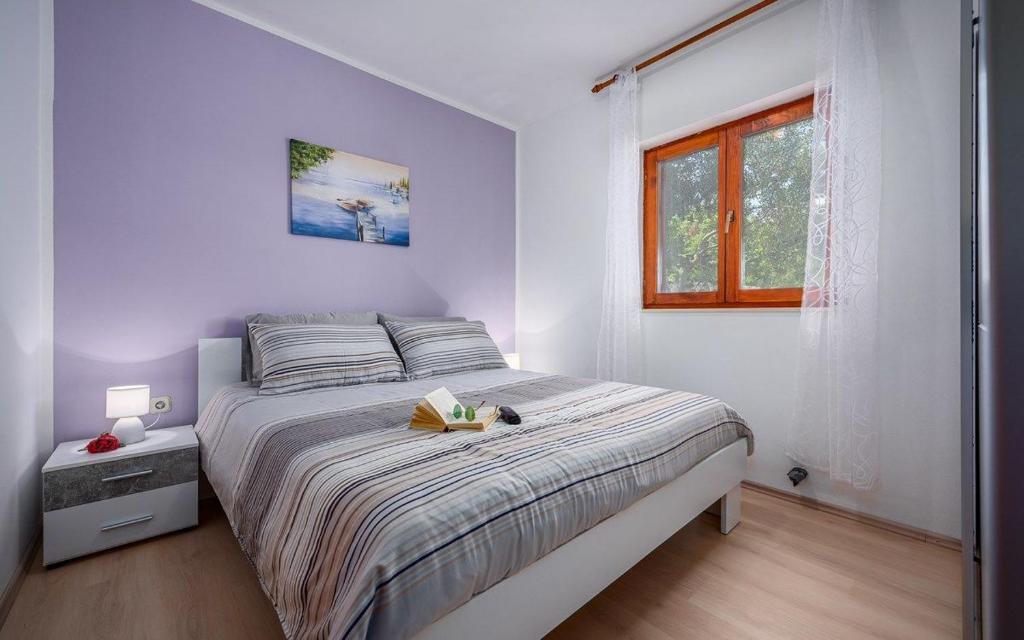 Posteľ alebo postele v izbe v ubytovaní Apartments Drenje