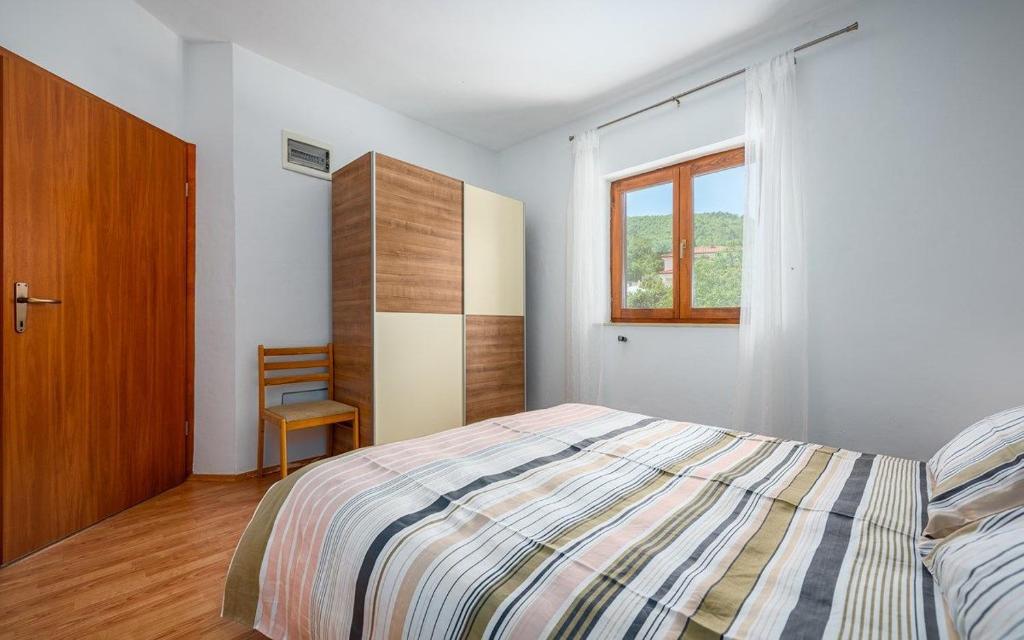 Posteľ alebo postele v izbe v ubytovaní Apartments Drenje