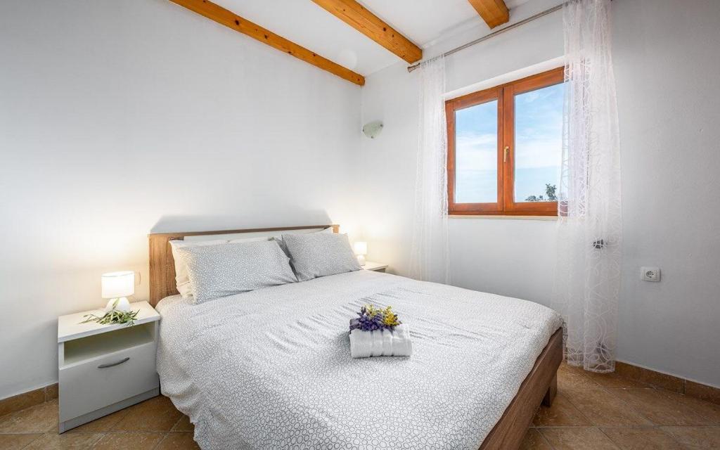 Posteľ alebo postele v izbe v ubytovaní Apartments Drenje