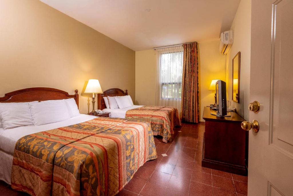 Hotel Santa Maria de Comayagua 객실 침대
