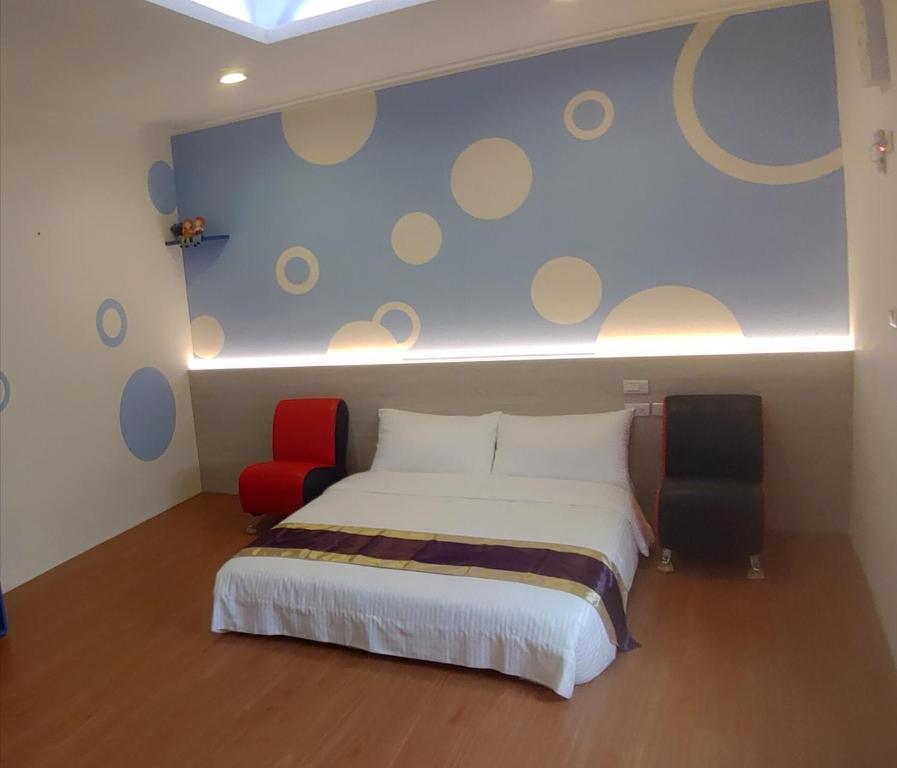 Postel nebo postele na pokoji v ubytování Purple Shell Homestay