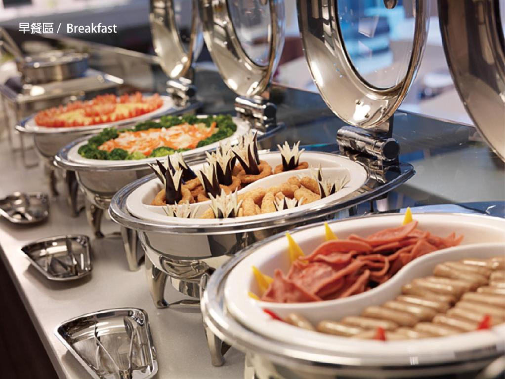 a buffet with several plates of food on a table at Dandy Hotel - Tianmu Branch in Taipei