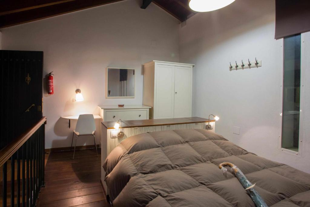 Cama o camas de una habitación en La Mina Rural Casas con encanto